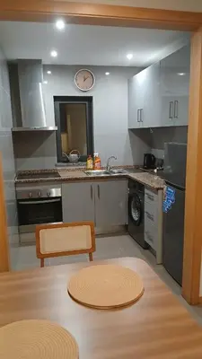 a kitchen with a sink and a dishwasher at Clara's Place - Faia Suite in Praia