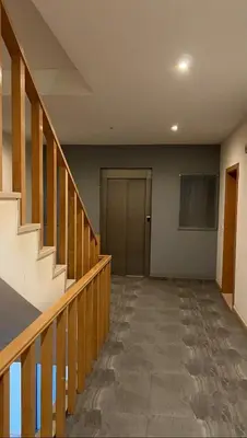 an empty hallway with stairs and a door at Clara's Place - Morabeza Suite in Praia