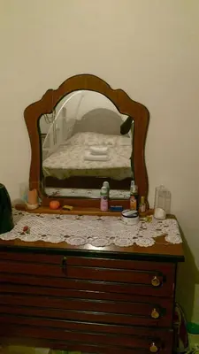 a dresser with a mirror on top of it at Maison Praia - Cap Vert in São Filipe