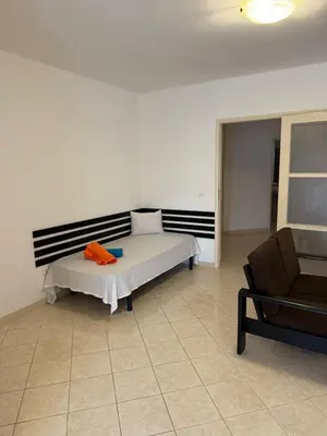 a bedroom with a bed and a chair at Murdeira V162 A by RPG Group in Beirona
