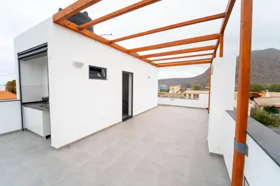 a balcony with white walls and a wooden roof at GREEN STUDIO TARRAFAL - Ap 04 in Tarrafal