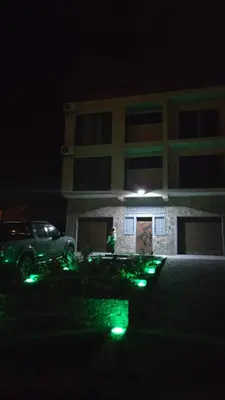 a person standing in front of a building at night at Ocean View Studio 4 in Mindelo