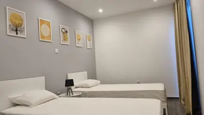 a bedroom with two beds and a mirror at Casa Morada in Mindelo