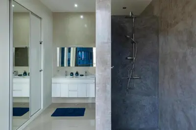 a bathroom with a shower and a sink at Marel Bliss Apartments T3 - Isabel in Mindelo