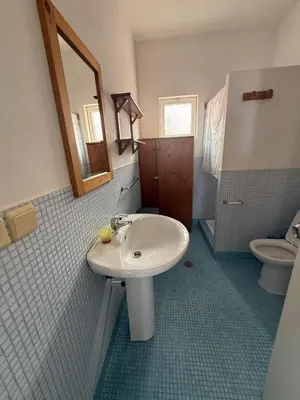 a bathroom with a sink and a toilet at A Casa do Amor in Vila do Maio