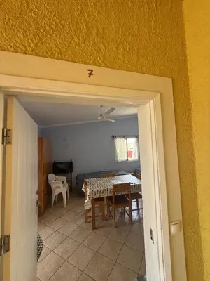 a kitchen and dining room with a table and chairs at A Casa do Amor in Vila do Maio