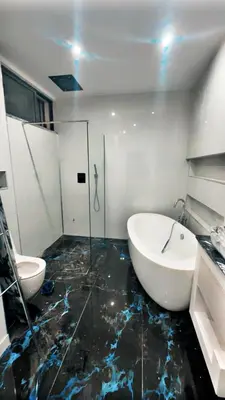 a bathroom with a sink and a tub and a toilet at Belle maison Cosy et Moderne in Praia