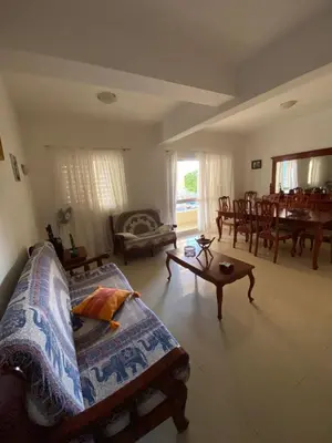 a living room with a couch and a table at Mindelo Family Apartment in Mindelo