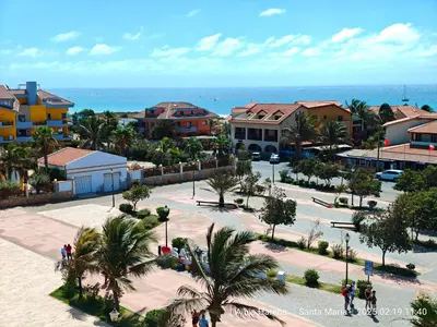 an aerial view of a town with palm trees and buildings at Studio Apartment in the Center in Santa Maria
