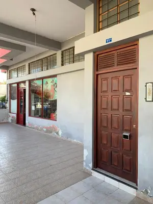 a large wooden door on the side of a building at Shay's House in Mindelo in Mindelo