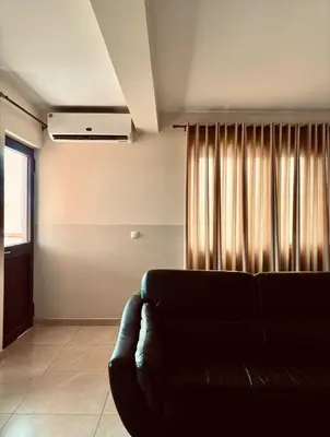 a living room with a couch and a window at Ferreira e Brito apartamentos in Espargos