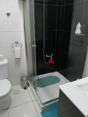 a bathroom with a shower with a glass door at O Meu Aconchego em Montsú in Prainha
