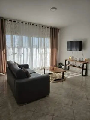 a living room with a couch and a table at Golden Flow in Espargos