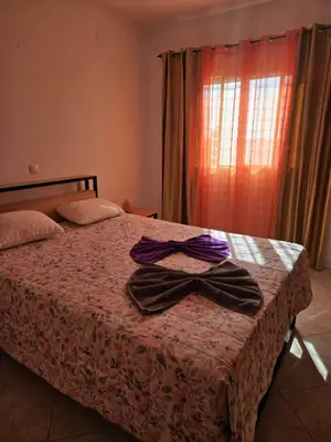 a bedroom with a bed with two bow ties on it at Golden Flow in Espargos