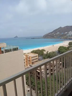 a view of the beach from the balcony of a condo at Apt T2 -Laginha -On The Beach in Mindelo