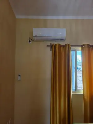 a room with a window and a air conditioner at Maio Sweet Tartaruga in Vila do Maio