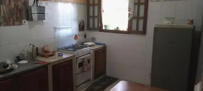 a kitchen with a stove and a sink and a refrigerator at AnaSpace in Praia