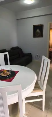 a white table and chairs in a living room at Pires's House in Mindelo