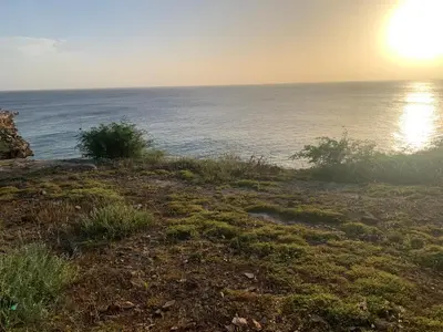 a view of the ocean from the shore of a beach at Casa TROPIKAL Maio Ponta Preta in Vila do Maio