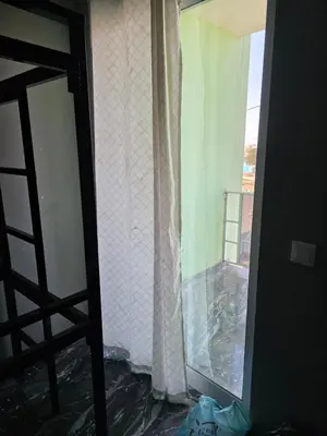 a window in a room with a view of a balcony at Mtechempire hostel in Espargos