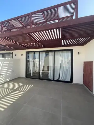 a garage with glass doors and a wooden ceiling at Lagoon Residence Ap6 in Sal Rei