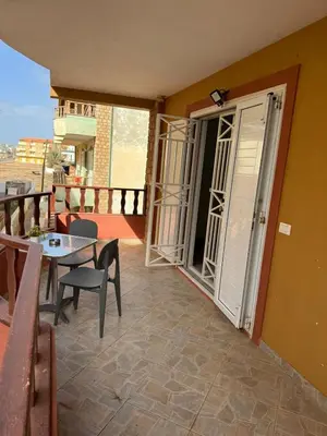 a balcony with a table and chairs and a door at Estrela do Sul Santa Maria by RPG Group in Santa Maria