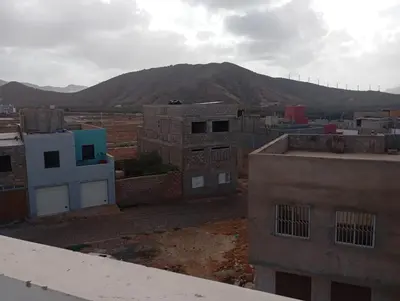 a view of a city with a mountain in the background at Ti Jona Rooms in Mindelo