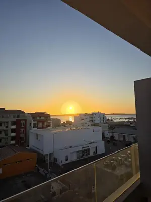a view of the sunset from the balcony of a building at The Zen Den in Sal Rei