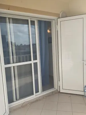 an empty room with sliding glass doors on a balcony at Holiday Properties Ca' Meli - Wi-fi in Santa Maria