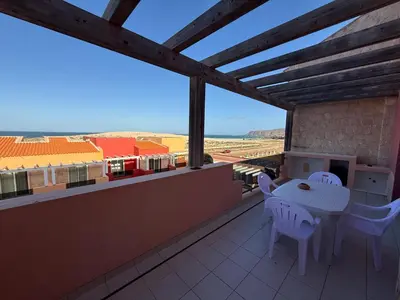 a balcony with a table and chairs and a view at Apartament POR DO SOL A9 praia Cabral wi-fi free Sal Rei in Sal Rei
