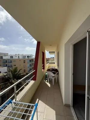 a balcony of a apartment with a table and chairs at Apartament ROSA DEI VENTI 3D Estoril Sal Rei in Sal Rei