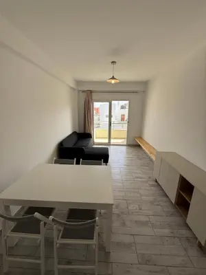 a living room with a table and a couch at Apartament ROSA DEI VENTI 3D Estoril Sal Rei in Sal Rei