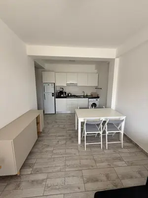 a kitchen with a white table and a white counter top at Apartament ROSA DEI VENTI 3D Estoril Sal Rei in Sal Rei