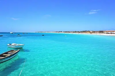 two boats in the water next to a beach at Central Santa Maria Sea view 2 Bedroomed Apartment in Santa Maria