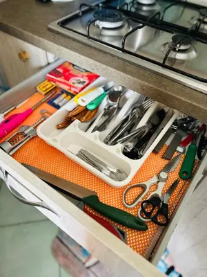 a drawer filled with lots of scissors and other tools at Santa Maria, 4min to Beach - Pool, AC, WiFi, De'Longhi coffee maker in Santa Maria