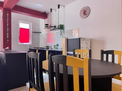 a kitchen with a dining room table and chairs at Rosa dei venti 4 in Santa Maria