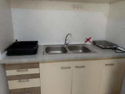 a kitchen counter with a sink and a toaster at Ca' Dolce Vita in Santa Maria