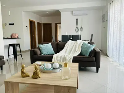 a living room with a couch and a coffee table at Holiday AP TF 2 in Praia