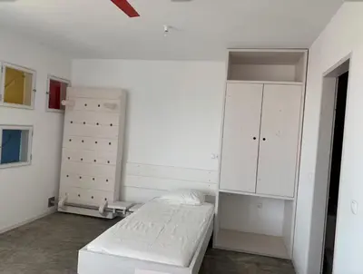 a white bedroom with a bed and a dresser at Modern&Central Mindelo - 1A in Mindelo