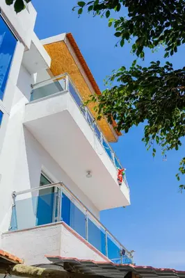 a balcony on the side of a building at Hospedaria Santo António in Praia Baixo