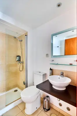 a bathroom with a toilet and a sink and a shower at T2 Santa Maria, Ilha do Sal, Cabo Verde - Melia Tortuga Beach Resort in Prainha
