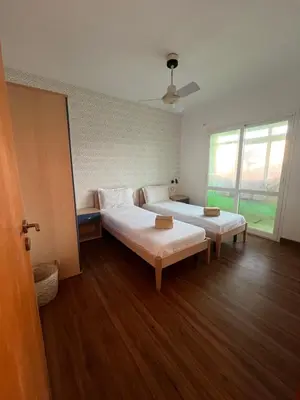 a large room with two beds and a window at WIND Ocean View Lobster Dinner Included in Santa Maria