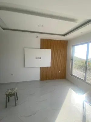 an empty room with a table and a window at Campo do campo ocean view in São Filipe