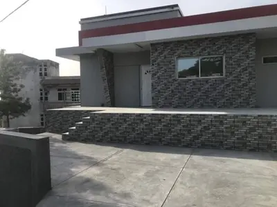 a building with a brick wall and a window at Campo do campo ocean view in São Filipe