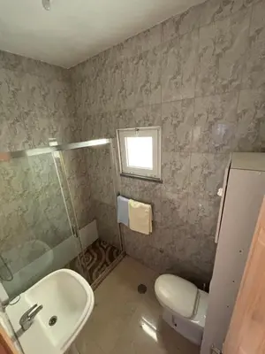 a bathroom with a sink and a toilet and a shower at La casa de iman in Praia