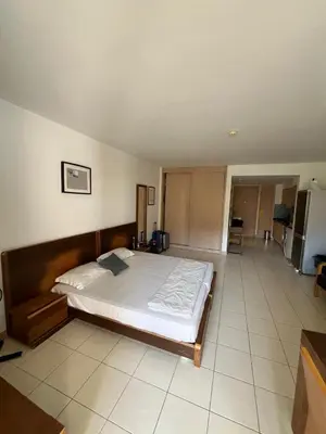 a bedroom with a large bed in a room at Vila Verde cozy studio in Prainha