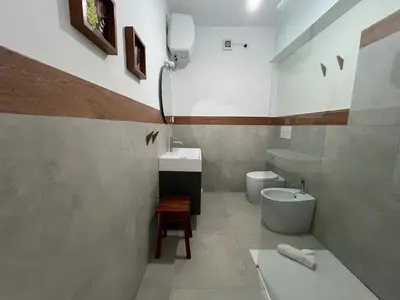 a bathroom with a sink and a toilet at Extraordinary sea view in Sal Rei