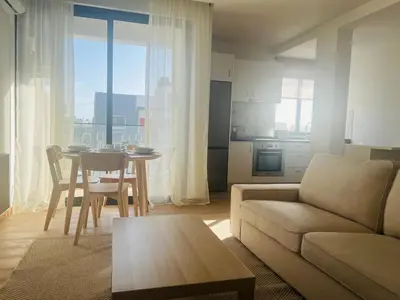 a living room with a couch and a table at Brisa Suites in Santa Maria