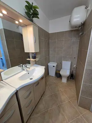 a bathroom with a sink and a toilet at La Vedetta Bella Vista Ocean View II in Santa Maria