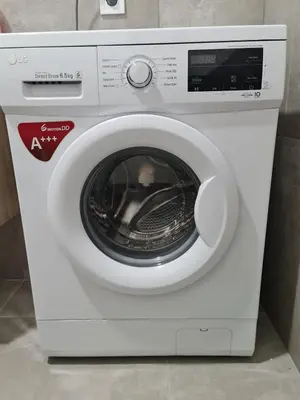 a white washing machine sitting in a room at Praça do Presidente com vista para o mar in Santa Maria